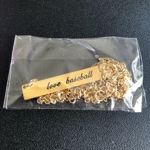 18 inch goldtone love baseball necklace with 2 inch extender.